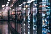 Row of supermarket freezers where refrigerant reform is sorely needed