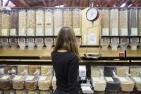 woman shopping in the bulk aisle